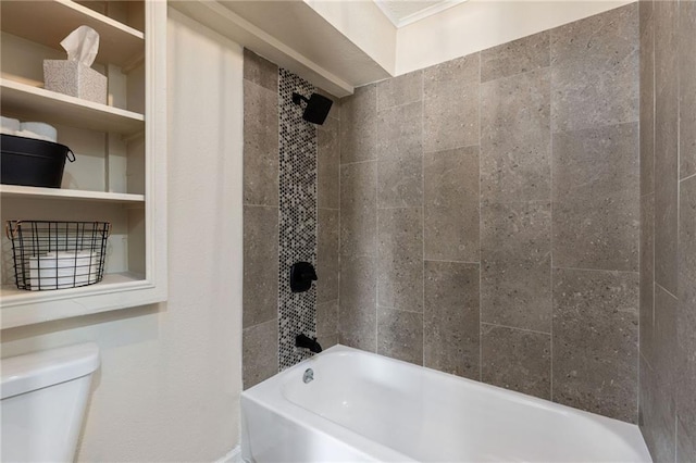 bathroom featuring toilet and tiled shower / bath combo