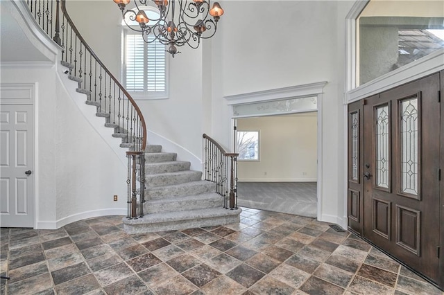 foyer featuring a chandelier and a high ceiling