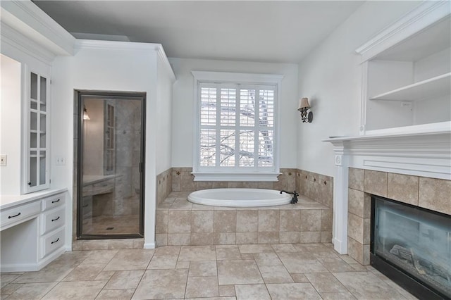 bathroom with a tiled fireplace, tile patterned floors, and shower with separate bathtub