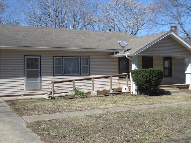 view of front of home with covered porch and roof with shingles