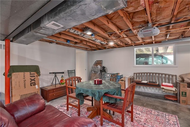 dining room with unfinished concrete floors and visible vents