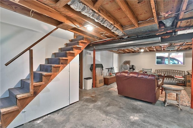 basement with visible vents and stairs