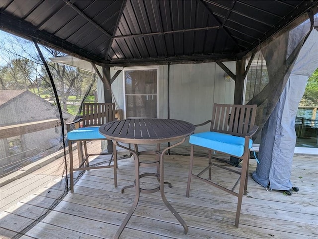 wooden terrace with a gazebo