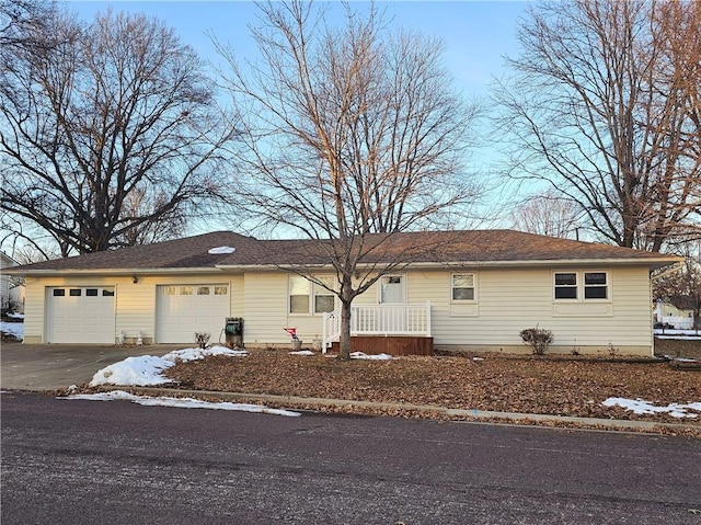 ranch-style home featuring a garage