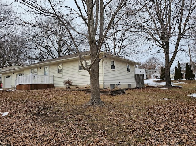 view of property exterior featuring an attached garage