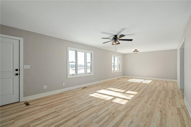 unfurnished room featuring ceiling fan and light hardwood / wood-style floors