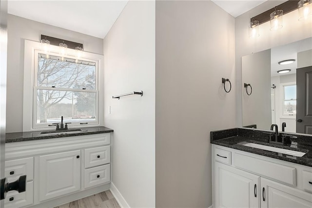 bathroom featuring vanity and hardwood / wood-style floors