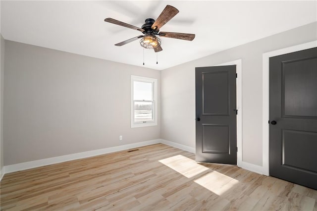 unfurnished bedroom with light hardwood / wood-style flooring and ceiling fan