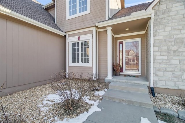 view of snow covered property entrance