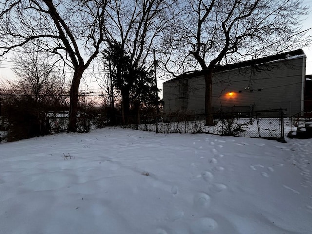 view of yard layered in snow