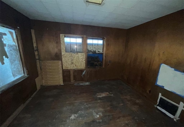 empty room with wood walls