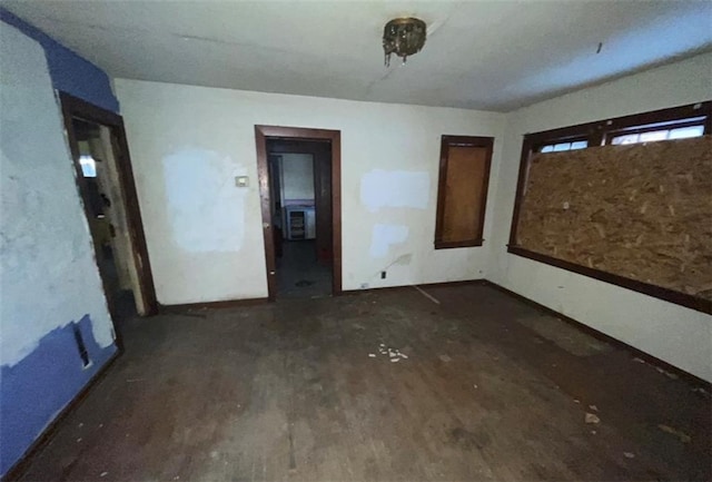 unfurnished bedroom featuring dark hardwood / wood-style floors