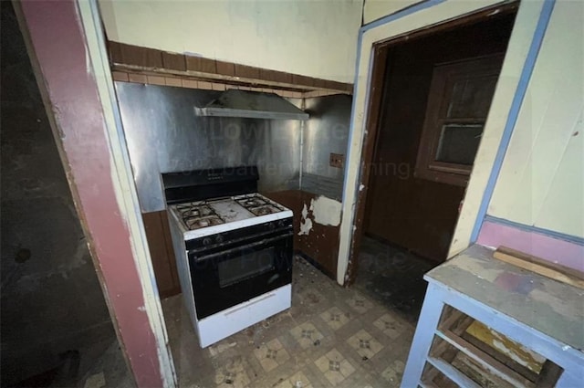 kitchen with white gas range