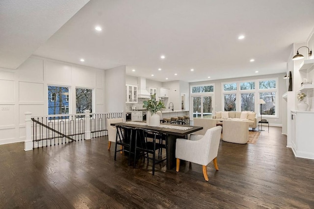 dining area with dark wood-type flooring and sink