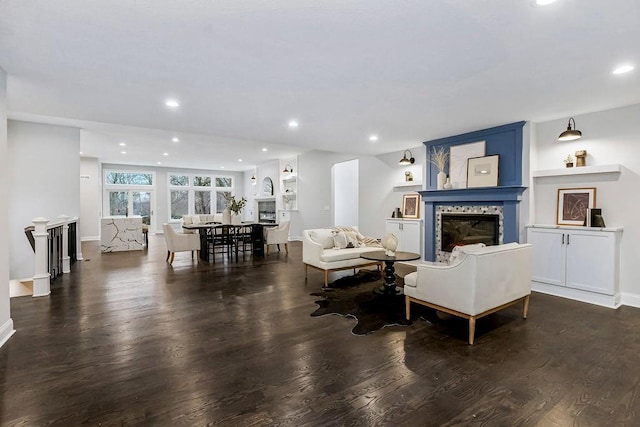 living room with dark hardwood / wood-style flooring