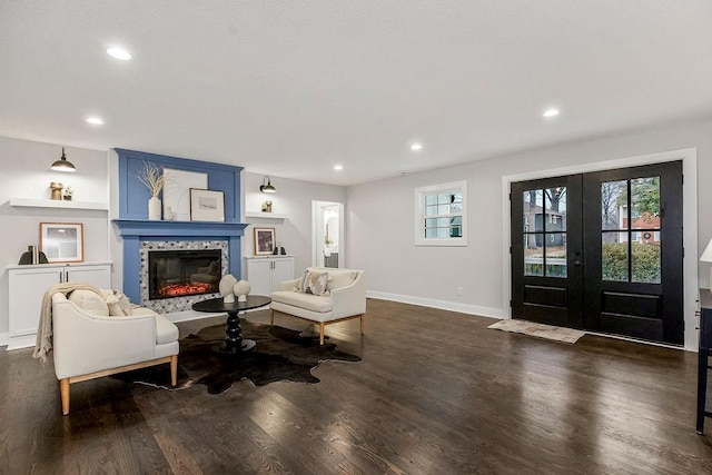 living room featuring french doors and dark hardwood / wood-style flooring