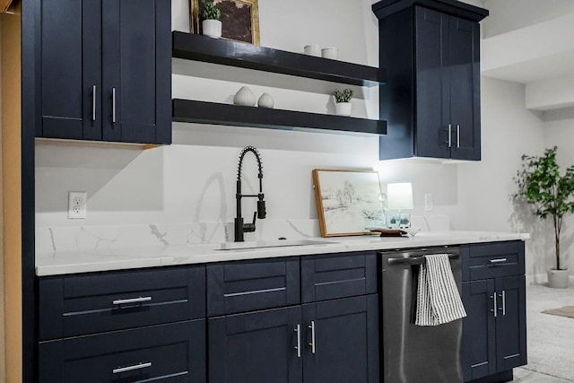 kitchen with stainless steel dishwasher, light stone countertops, and sink