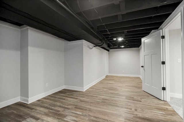 basement featuring light hardwood / wood-style floors