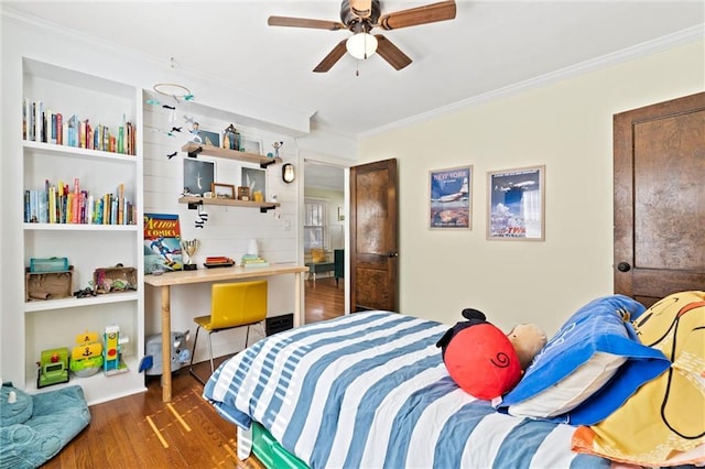 bedroom with crown molding, a ceiling fan, and wood finished floors