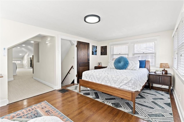 bedroom featuring light wood-style flooring and baseboards