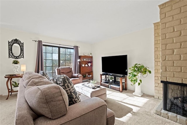 carpeted living room with a fireplace