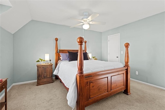 bedroom with lofted ceiling, light colored carpet, and ceiling fan