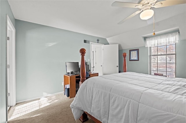 bedroom featuring ceiling fan, vaulted ceiling, and carpet