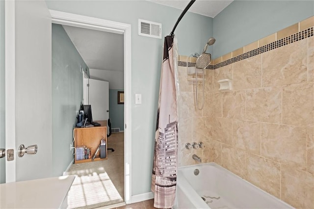 bathroom featuring shower / bathtub combination with curtain