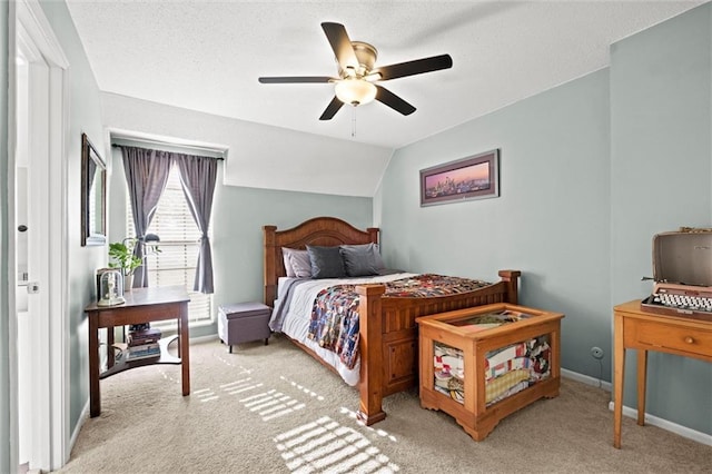 bedroom with ceiling fan, lofted ceiling, and light colored carpet