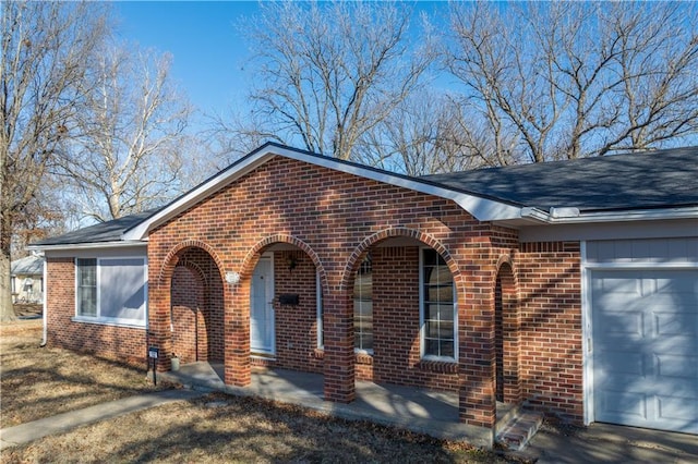 view of front of property featuring a garage and covered porch