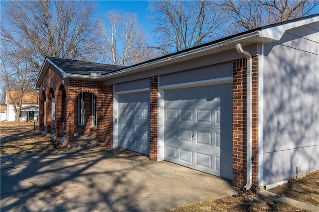 view of side of home with a garage