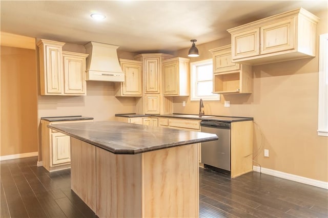 kitchen featuring premium range hood, sink, a center island, stainless steel dishwasher, and dark hardwood / wood-style flooring