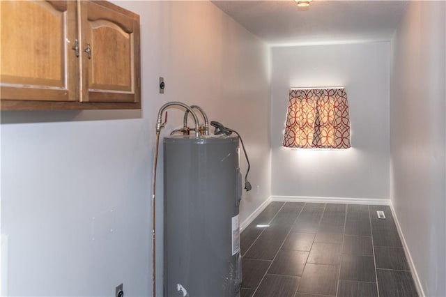 utility room featuring electric water heater