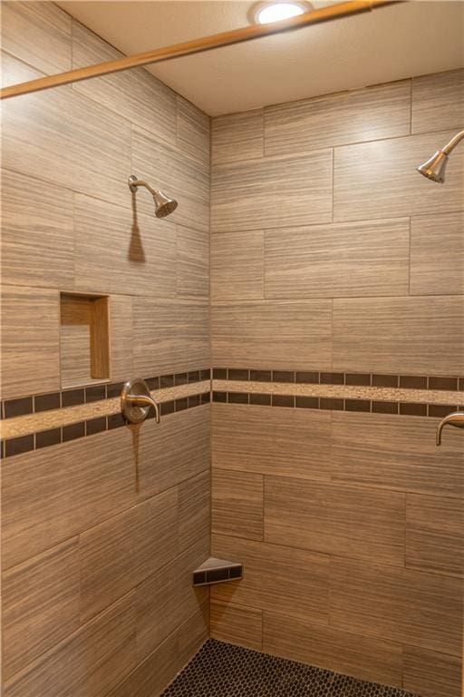 bathroom with tiled shower