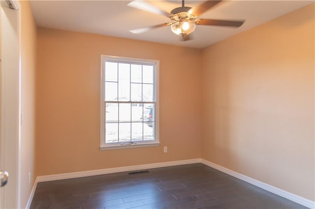 unfurnished room featuring dark hardwood / wood-style floors and ceiling fan