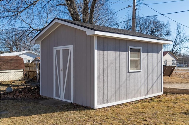 view of outdoor structure featuring a lawn