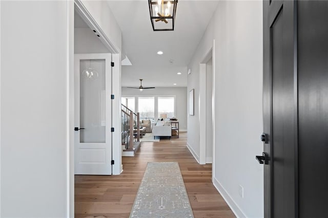 corridor featuring light hardwood / wood-style floors