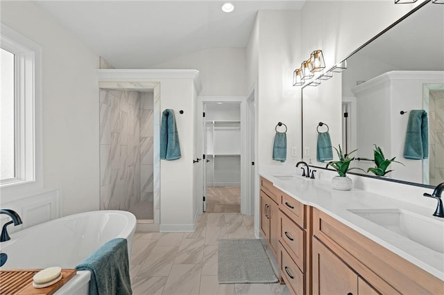 bathroom with vanity, lofted ceiling, and shower with separate bathtub