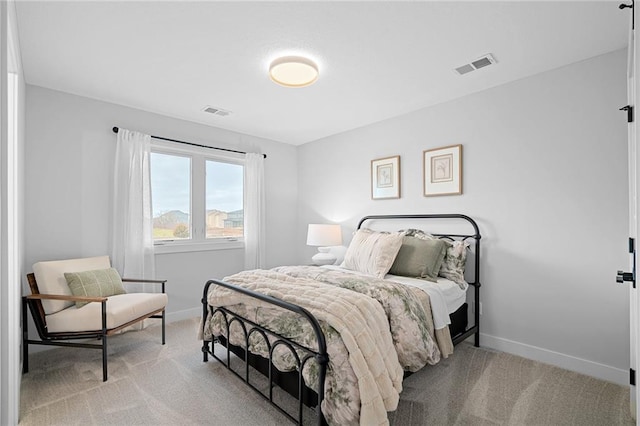 bedroom featuring light colored carpet