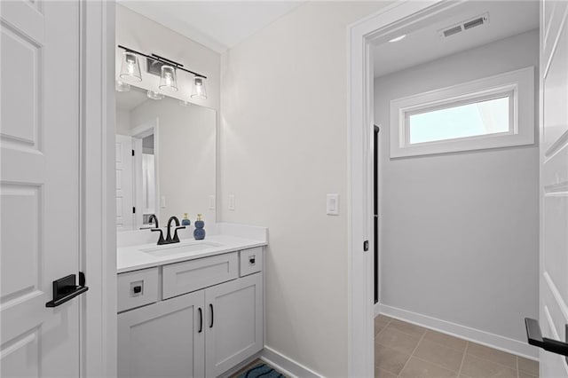 bathroom with vanity and tile patterned flooring