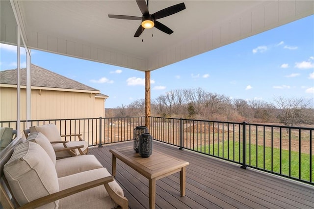 wooden terrace featuring ceiling fan