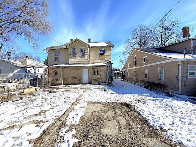 view of snow covered house