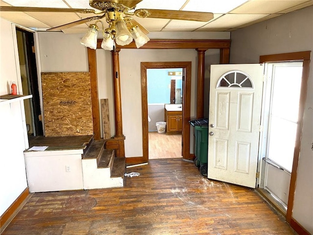 entrance foyer with dark hardwood / wood-style floors, a paneled ceiling, and ceiling fan