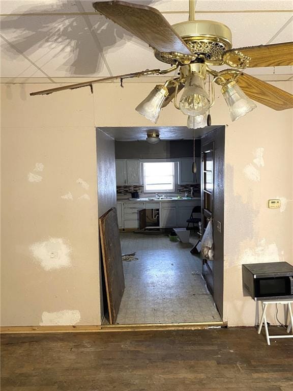 kitchen featuring dark wood-type flooring and ceiling fan