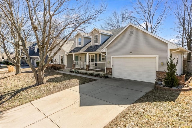 cape cod-style house featuring an attached garage, covered porch, driveway, and brick siding