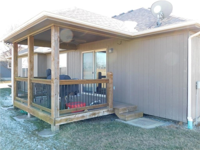 wooden deck featuring a lawn