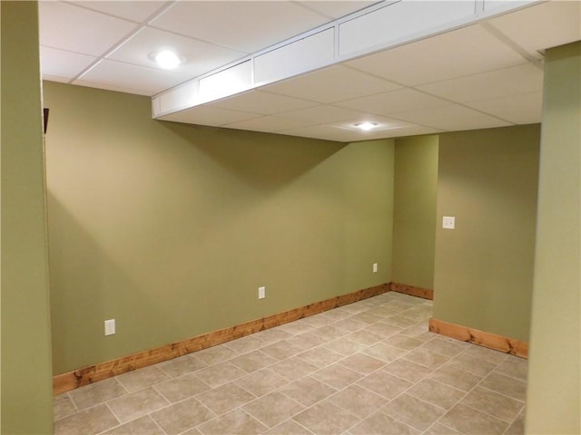 basement featuring a drop ceiling