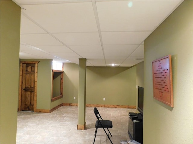 basement featuring a drop ceiling