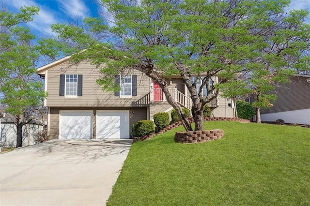 view of front of property with a garage and a front yard