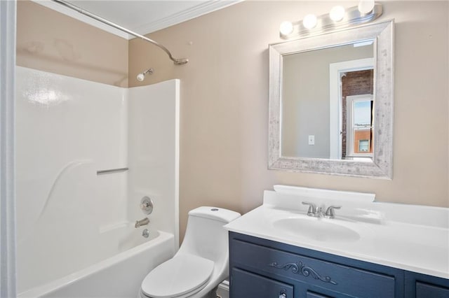 full bathroom with crown molding, vanity, toilet, and bathtub / shower combination